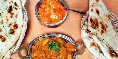 Butter Chicken with Naan - Daksh Restaurant's signature Indian dish